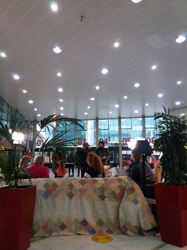 A view from behind of interviews happening on a large couch in Busáras