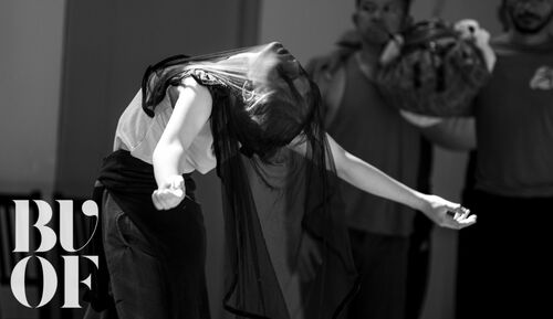 Rosie Stebbing arched backwards with a sheer veil over her face