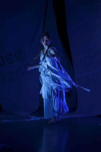 Rosie Stebbing in movement lit in blue