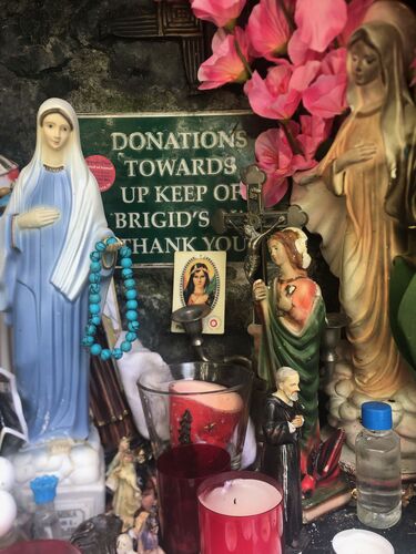 Votives and holy statues at a shrine