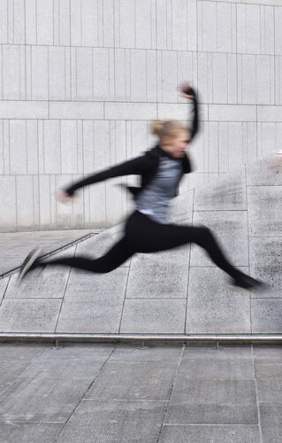 A figure airborne in blurred motion