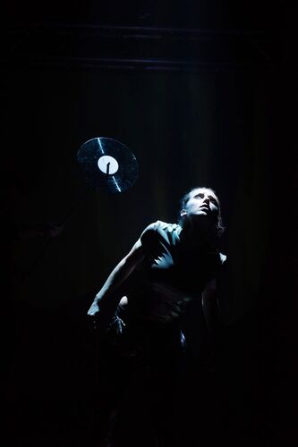 Ivonne Kalter looking upward on a dark background