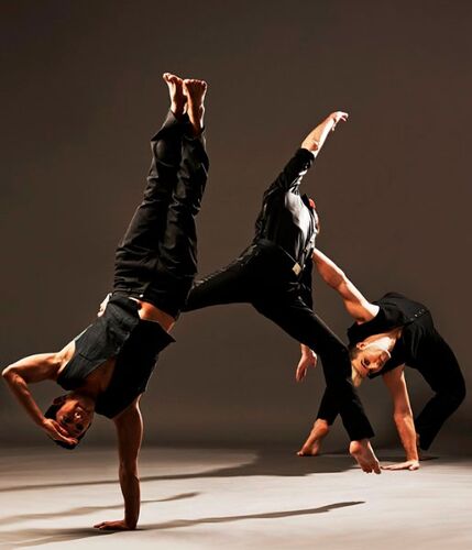 Three figures in movement