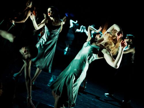 An ensemble of dancers in movement