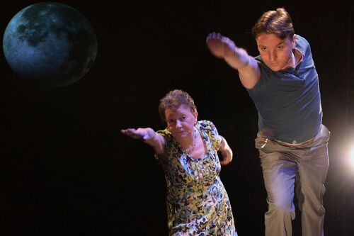 Two figures in movement resembling a front-crawl