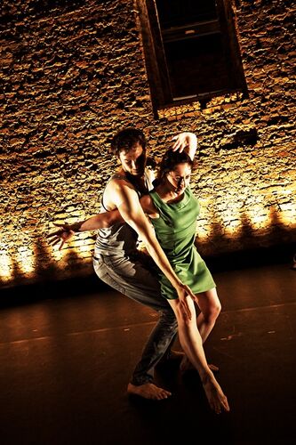 Two figures in movement together