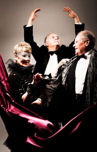 Three participants in black tie in movement