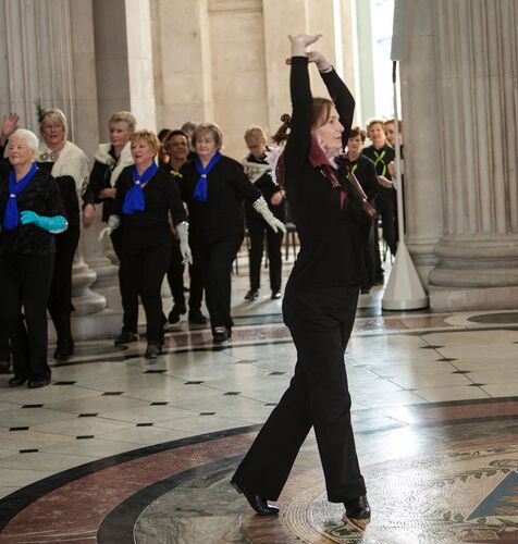 A participant performing a solo with an ensemble behind