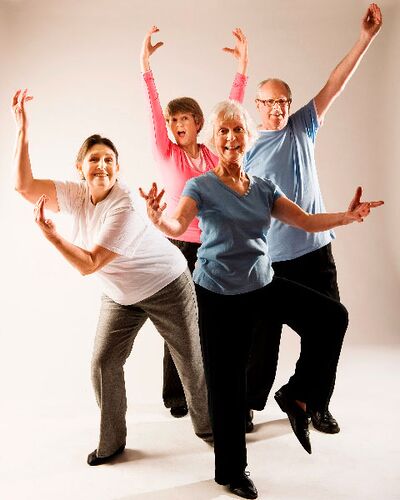 Four participants in movement in a photo studio
