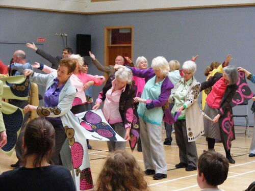 Participants in movement performing for an audience