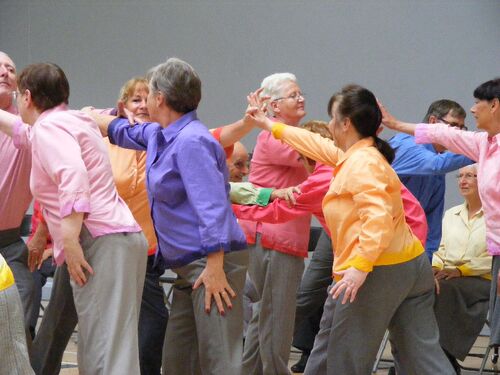 Participants in brightly coloured shirts in movement