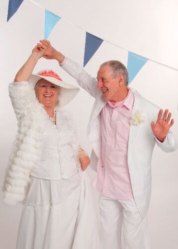 Two participants dancing together with one mid twirl