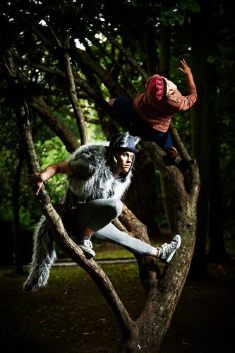 Ivonne Kalter & Mateusz-Szczerek perched between tree branches outdoors