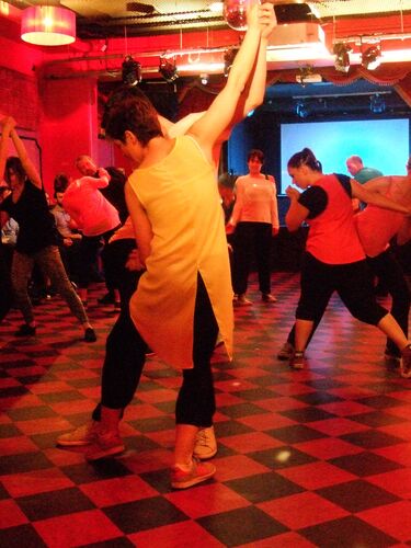 An ensemble of participants in movement in pairs