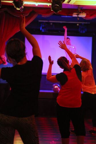 An ensemble of participants in movement seen from behind