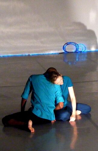 Two participants in movement on the floor