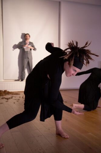 A participant in movement dressed all in black