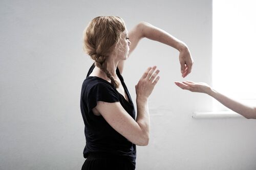 A figure in movement in a studio
