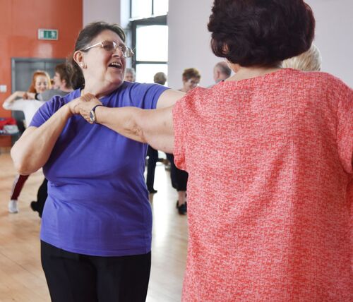Two participants dancing together