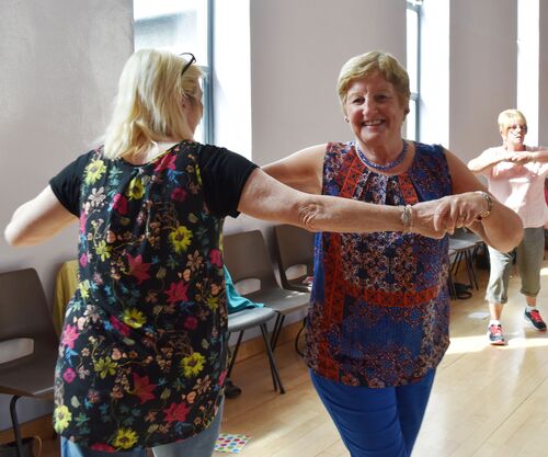 Two participants dancing together