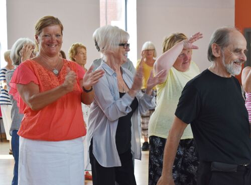 Participants dancing in a hall