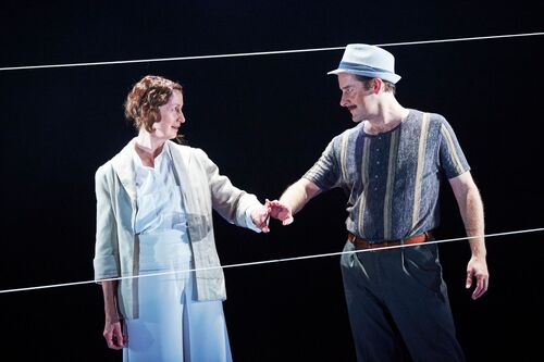 Two figures with hands touching