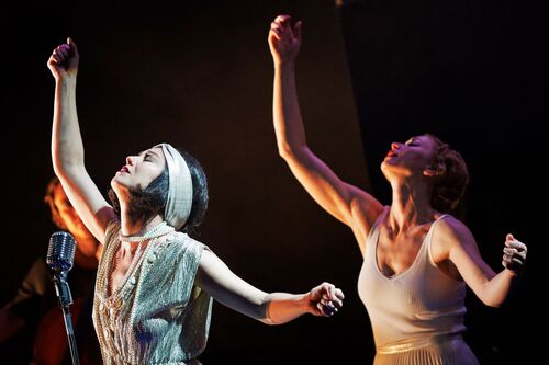 Two figures mirroring the same movement