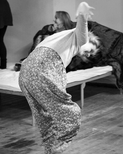 A participant in movement in black and white