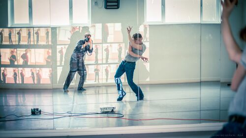 David Bolger in movement reflected in the studio mirror as he is filmed