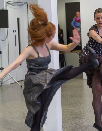 Olwyn Lyons in movement costumed in silver