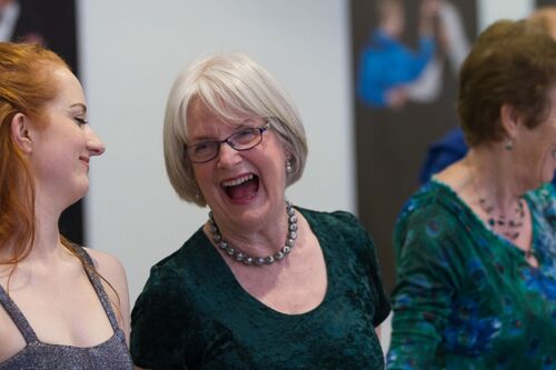 A close up of a participant laughing