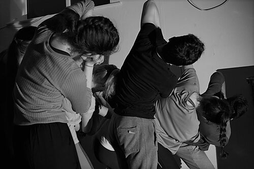 Participants in movement in black and white