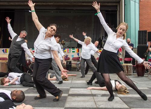 An ensemble of participants in movement outdoors