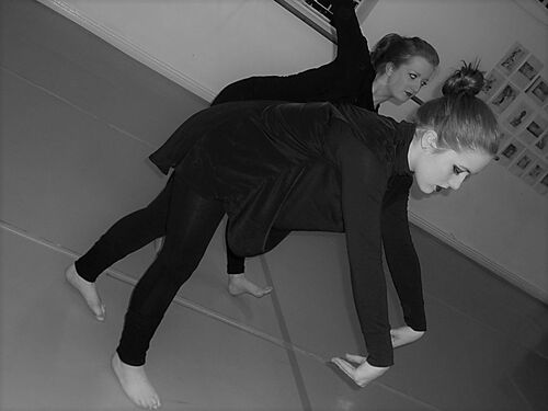 Two participants in movement in black and white