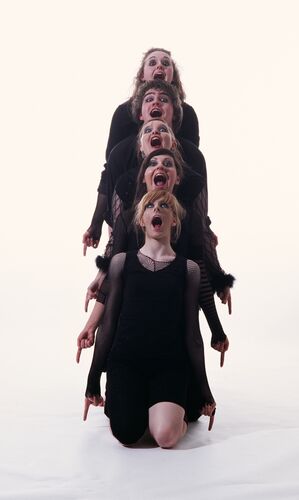 A sloped single file line of participants with mouths open as though shouting