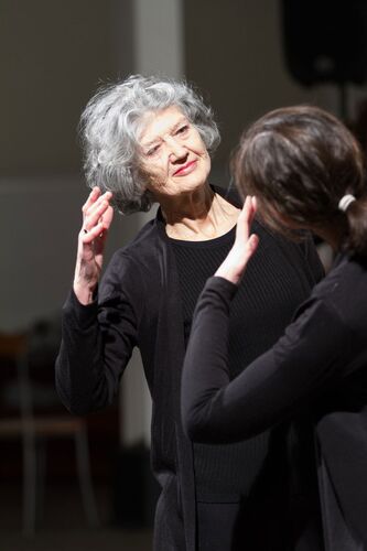 Two participants facing each other in movement