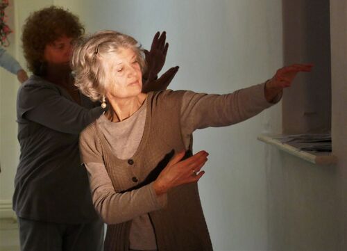 A participant cast in light in movement