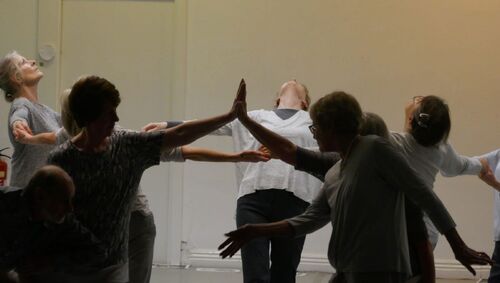 Participants all in grey in movement