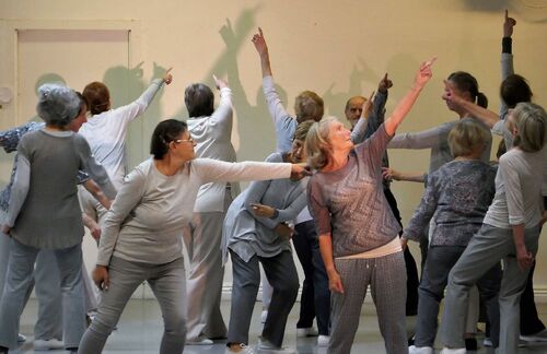 Participants all in grey in movement