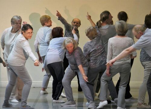 Participants all in grey in movement