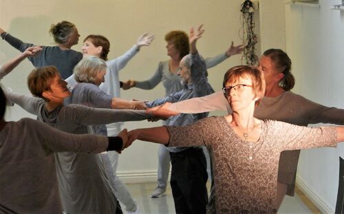 Participants holding hands in movement