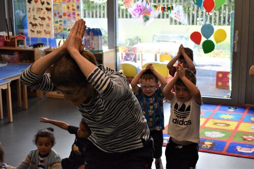 Philippa Donnellan leading a line of children in movement