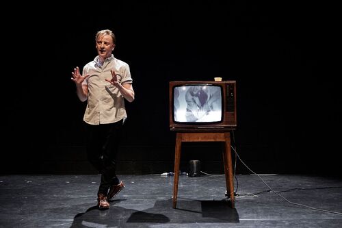 David Bolger on stage beside a retro television set