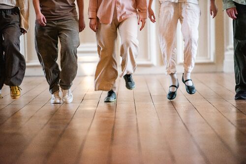The legs of the dancers in movement