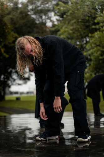 A man bent over the ground