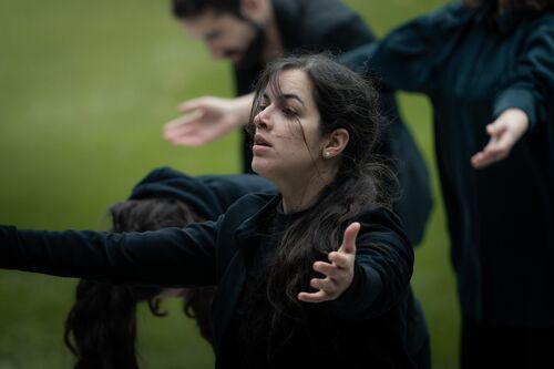 A dancer in a movement with the open hands