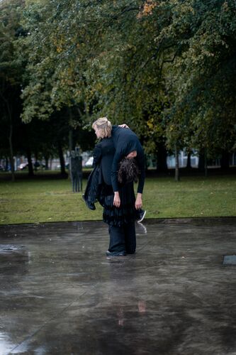 A woman carrying a woman on her shoulders