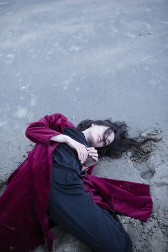 A young woman lying on the ground
